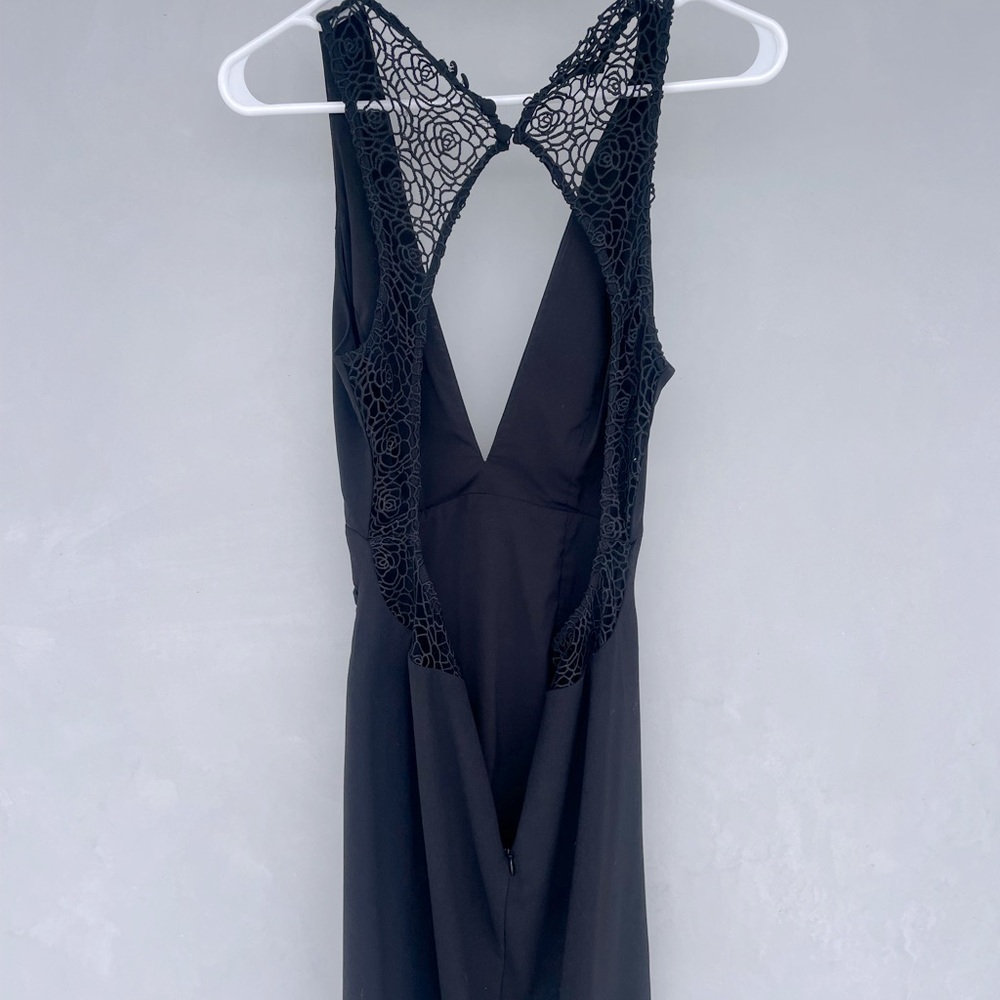 Black cocktail dress. Open low back and low plunge top.